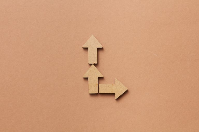 Three cardboard arrows representing choice and strategic direction.