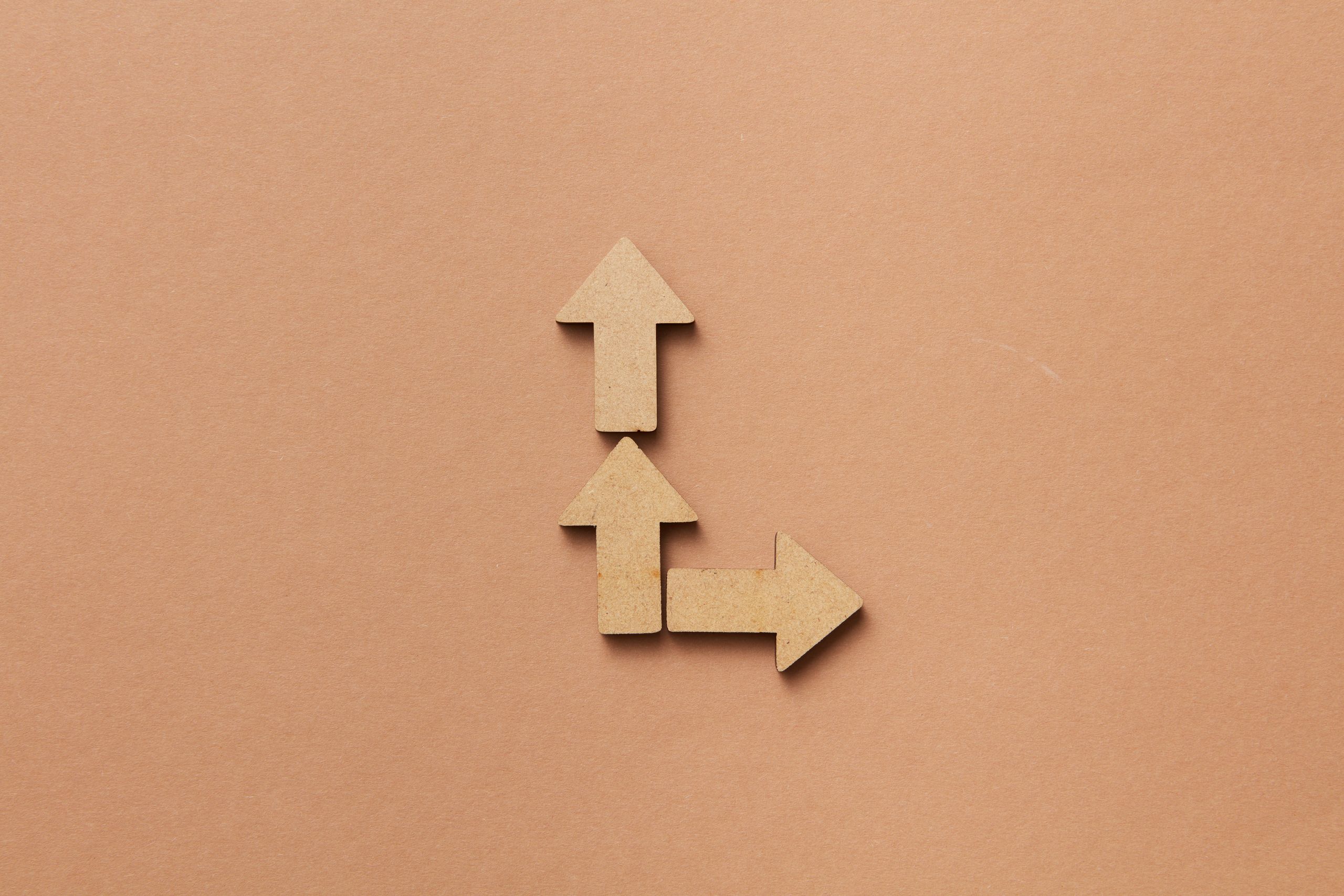 Three cardboard arrows representing choice and strategic direction.